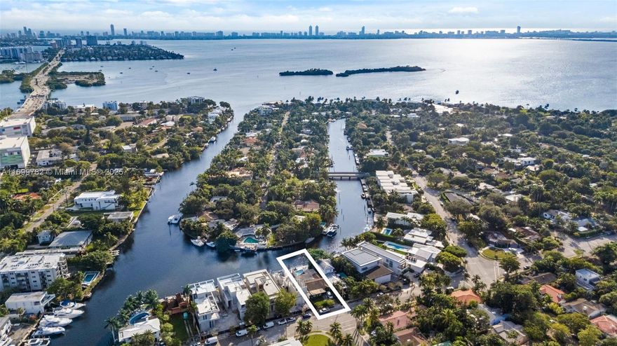 Charming waterfront Mediterranean residence. Deep canal w/direct access to the Bay and Ocean, located in 24 HR gated community.  Remodeled with four bedrooms & generous sizes, Gourmet kitchen, high exposed wood ceilings, beautiful water and garden views. Spacious backyard, with pool, jacuzzi and lush landscape. 50 ft of waterfrontage and full dock. Miami's Belle Meade community is centrally located, minutes to Design District, Downtown Miami, & Beaches. Least expensive waterfront home in the Belle Meade. Will not last, Real Seller!