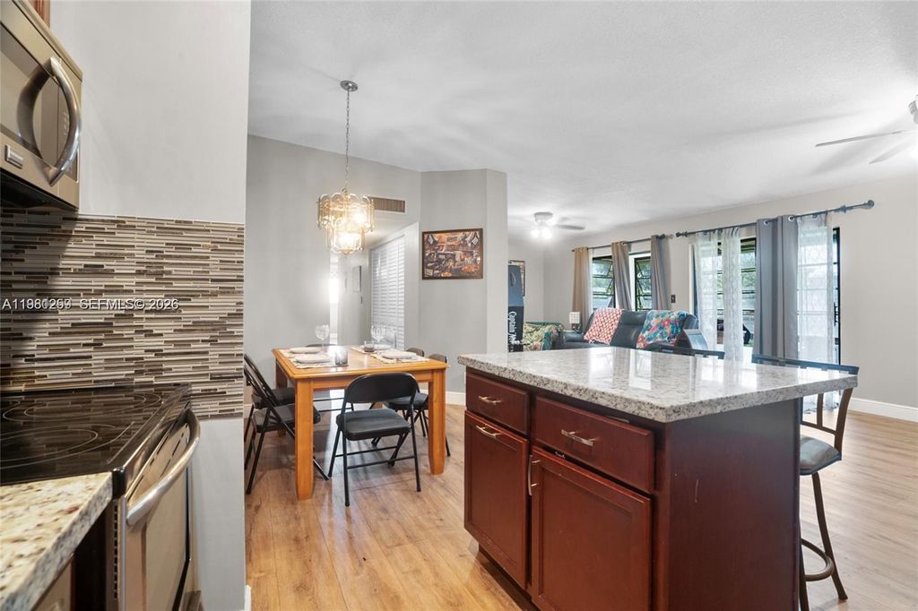 Photo of 9606 W Mcnab Rd #202, Tamarac, FL 33321 (MLS # A11981259)