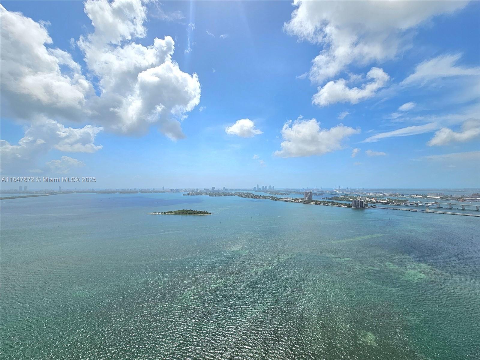 Be the 1st to live in this designer ready unit at the highly anticipated Aria Reserve. This home offers breathtaking views of Biscayne Bay, the Miami Beach Skyline and the Atlantic Ocean. This residence features floor-to-ceiling impact glass with spectacular sunrise views. The luxury Thermador gourmet kitchen opens into the bright spacious living area with spectacular bay vistas from every corner of the room. This home is designed for relaxation and entertaining. Primary bedroom includes its own en-suite luxury bathroom with walk-in closet. Guest suite has its own en suite full shower bath. Unit has a Den/Office interior space, also with a full shower bath, that can be converted/enclosed into a 3rd bedroom or added on to the Primary closet to create the ultimate showcase closet space.