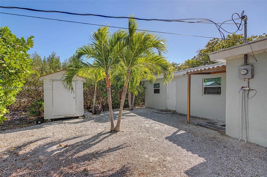 Beautifully remodeled concrete home with impact windows on a generous lot in a quiet, private area of Big Pine Key in Doctor's Arm. This unique 2-bedroom, 2-bath residence offers a flexible layout that may appeal to those seeking separate living areas under one roof. The home features two distinct living spaces, each with its own kitchen and bathroom, providing versatility for extended family, guests, or mother in law suite. The property has been thoughtfully updated and is concrete, offering peace of mind. Enjoy the true Keys lifestyle with frequent visits from the native Key deer right in your backyard. Located just minutes from the water, this home offers privacy, space, and a rare opportunity to own a move-in-ready property in a natural island setting. The oversized lot allows ample room for vehicles, boats, or RV parking for personal use. A must-see property with endless possibilities across the street from Old wooden bridge marina. Front of house gets accessed by Watson Blvd. NOT Witters Lane. PLEASE DO NOT WALK AROUND THE PROPERTY WITHOUT APPOINTMENT