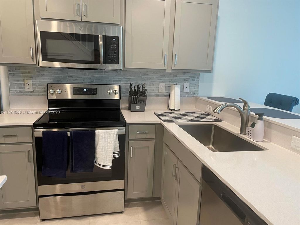 Photo of 5032 Genove Pl, Riviera Beach, FL 33410 (MLS # A11474956)