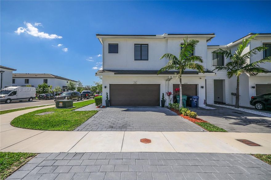 Newly built in 2022, this modern residence offers 11-foot ceilings, hurricane-impact windows, and elegant zebra blinds on the first floor. The kitchen features granite countertops and a Samsung touchscreen refrigerator.

Upstairs includes laminated floors, zebra blinds, and blackout shades. The primary suite offers dual sinks, and two additional bedrooms share a Jack-and-Jill layout.

Additional features: 2022 washer & dryer, concrete tile roof, attic, dual water heater system, and a spacious double garage fitting up to 4–5 cars. Extra parking available near the clubhouse and on the street.