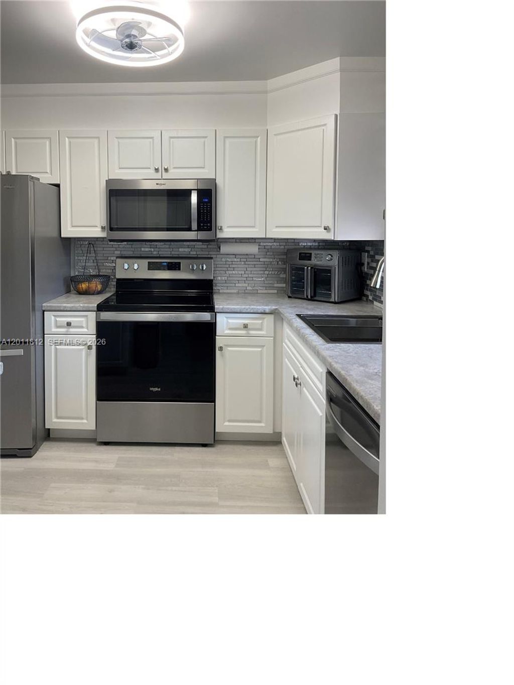 Photo of 9350 Sunrise Lakes Blvd #307, Sunrise, FL 33322 (MLS # A12011812)
