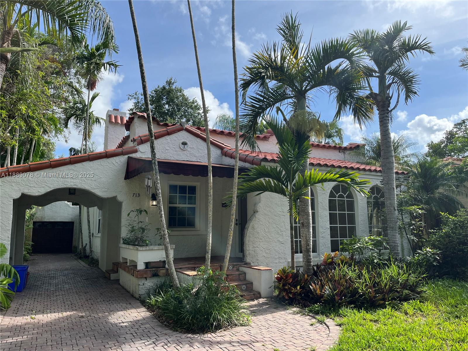 A Beautiful Old Spanish House with character and charm. Top Coral Gables location in the prestigious Platinum Triangle neighborhood. Close to the best private schools in the city and zoned to Sunset Elementary (one of the best Public Schools). The house features a spacious formal living and dining room, wood-burning fireplace, hardwood floors, breakfast area, impact windows, landscaped backyard, detached garage and covered carport. Ideal for a family or professional looking for one of the best and quiet areas in Miami.