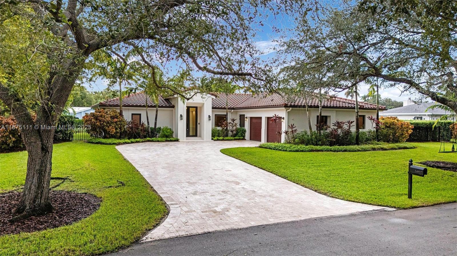 Canal-front residence tucked on a tree-lined cul-de-sac. Beautifully remodeled with modern transitional architecture and refreshed exterior: travertine driveway, flat stucco, impact windows/doors, landscaping, and newer roofline. Outdoor oasis with 1,200 SF covered porch and 36x14 saltwater pool (2019) framed by lush privacy landscaping. Interior features include remodeled baths, hardwood and marble floors, and a convenient split floor plan with multiple living areas. Versatile fourth bedroom can be used as office or playroom. Recent updates: A/C, ducts, appliances, insulated garage doors (2024) and 2014 roof. Built 1989 — avoids many older-home plumbing/electrical issues. Close to top public and private schools. Move-in ready, combines luxury, comfort and convenience.
