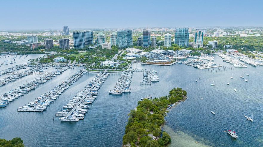 NEW PRICE!!!   UNOBSTRUCTED DIRECT SAILBOAT BAY AND CITY VIEWS FROM THIS 16/17TH FL 2-STORY 3/3-1/2 UNIT IN GROVE AT GRAND BAY'S SOUTH TOWER.  Impeccably designed by 'Salvatore LaRosa' of BFiveStudio, offers two oversized terraces, 12-foot ceilings, and an open living design with a Chef's kitchen.  All rooms have breathtaking views of the Bay and City— a unique residence being offered fully furnished. All custom-made furniture.  Oversized terraces on each level.  Private elevator entry.  Art, personal items, and two light fixtures are excluded.