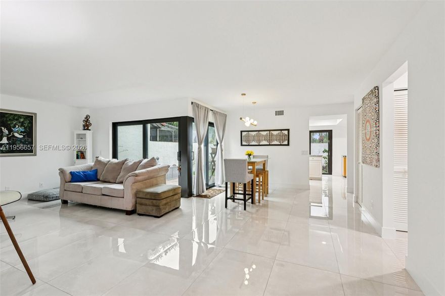 Welcome Home! Nestled in Crossing Townhomes, this serene and friendly neighborhood boasts charming tree-lined streets, ideal for joyful strolls to relax and embrace nature.  The owner has curated the garden into a delightful haven, alive with squirrels, butterflies, and hummingbirds. The home features 4 bedrooms, 3 bathrooms - Primary bedroom downstairs, over 1900 square feet of space to spread out and a backyard overlooking the vibrant park. There are impact windows and doors, new floors, and modern appliances. Being walking distance to the community pool and clubhouse and shopping, it is perfect for families or new owners that like to entertain.  It has been lovingly cared for and is ready for you to add your personal touch and make it your own. FHA and VA buyers are welcomed.