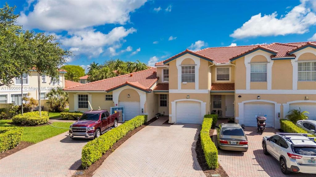 Photo of 11635 NW 47th Ct, Coral Springs, FL 33076 (MLS # A11800667)