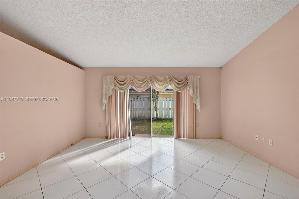 Photo of 1306 NW 125th Ter, Sunrise, FL 33323 (MLS # A11937319)