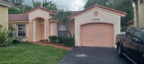 Photo of 1306 NW 125th Ter, Sunrise, FL 33323 (MLS # A11937319)