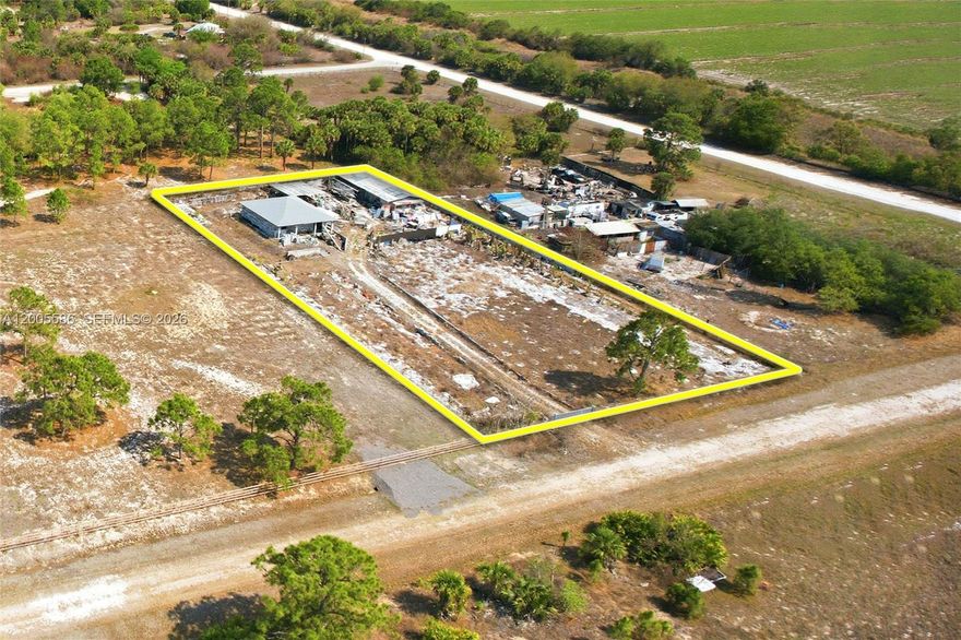 1.25-acre property offering great potential for development or customization. The lot is fully fenced, providing added privacy and security. The property includes two existing structures: a large shed/storage building and an unfinished concrete residential home with a roof already in place. The home is a blank canvas, no windows installed, ready for a buyer to complete to their own specifications. Plenty of space for expansion, additional structures, or outdoor features. Seller is motivated and open to all offers.