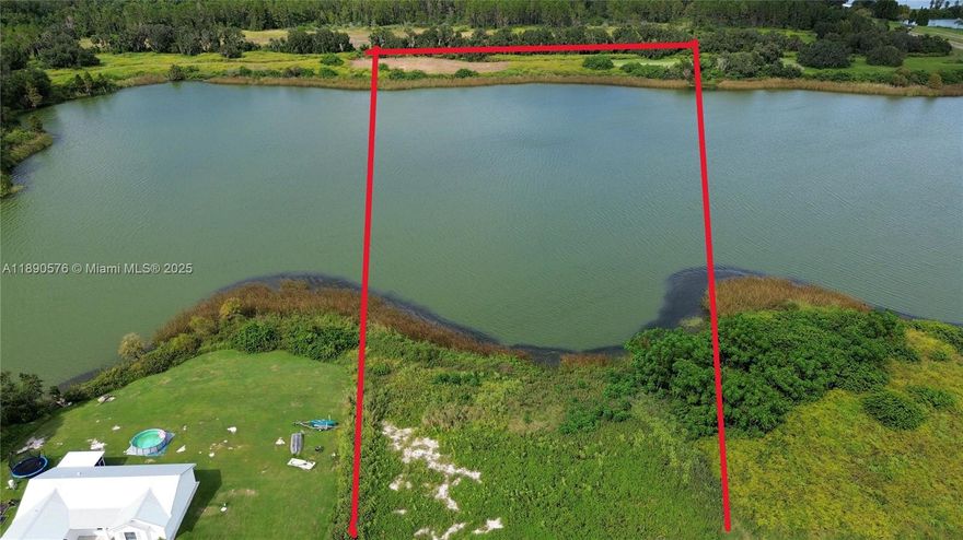 LAKEFRONT ACREAGE! Ideal location for your Retirement Home. 5 Acres Boardering a Spectacular Lake! Quiet Road of the beaten path in Lake Meade Florida!