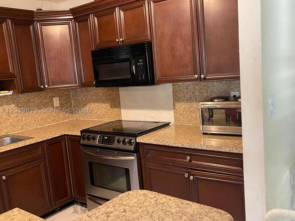 Photo of 2230 NW 32nd Ter, Lauderdale Lakes, FL 33311 (MLS # A12039875)