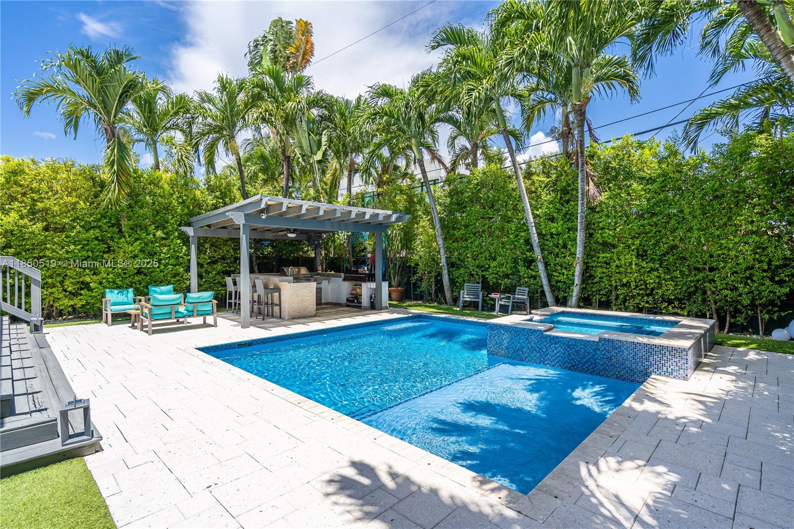Experience luxury living in this exquisitely renovated 3-bedroom, 3-bathroom home nestled in the prestigious Lakeview neighborhood of Miami Beach. Bathed in natural light, the open floor plan seamlessly blends indoor and outdoor living, perfect for hosting gatherings. The kitchen features premium stainless steel appliances, sleek quartz countertops, and custom cabinetry. Each bedroom is generously sized, while the primary suite offers a tranquil retreat. Outside, unwind in your private tropical paradise, complete with a sparkling pool surrounded by lush landscaping and a gazebo with an outdoor kitchen. Ideally located just minutes from pristine beaches, top-rated schools, upscale shopping, and fine dining, this home offers the ultimate Miami lifestyle.