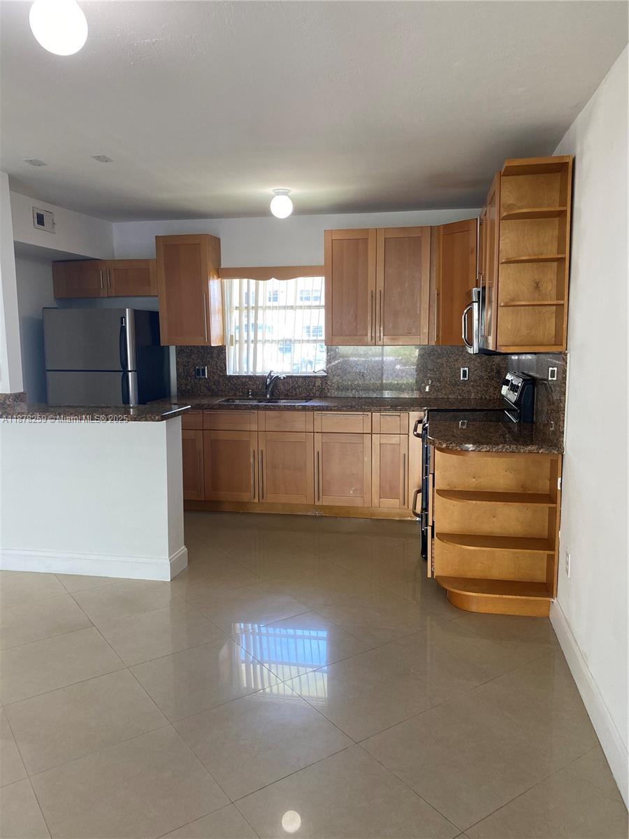 Cozy 1-bedroom condo in the desirable Village at Dadeland community. Conveniently located near Dadeland Mall, restaurants, and major highways, this ground-floor unit offers easy access to shopping and dining. Featuring tile flooring throughout, a well-kept kitchen, and an open living space, it’s perfect for a first home or investment property. Assigned parking plus guest parking available.
