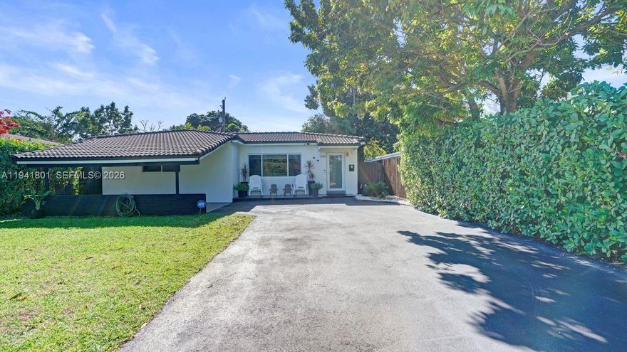 Step into this beautifully updated 3BR/2BA home, fully renovated with permits in 2019. Enjoy a new roof, stylish kitchen, spa-like baths, and stainless steel appliances. Impact windows, tankless water heater, and front-loading washer/dryer make it even more complete. Tall front hedges offer privacy, new brown aluminum fence, covered patio, mango tree, and oversized driveway complete this inviting retreat.