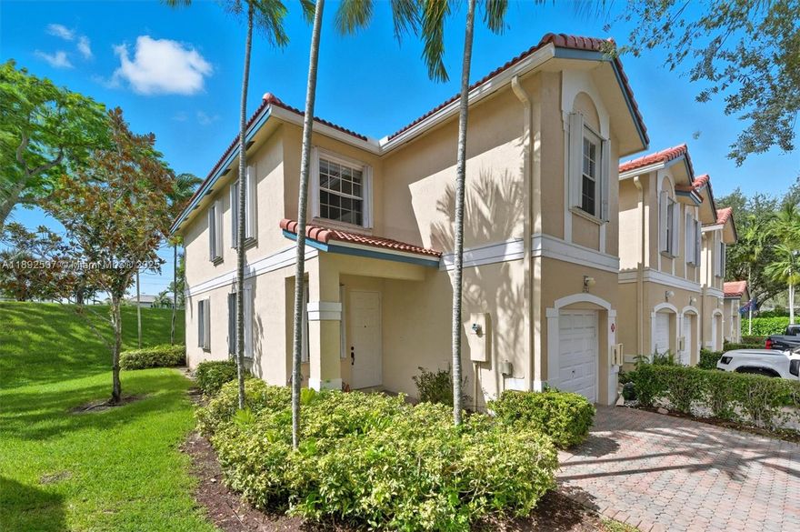 Experience the perfect blend of privacy, style, and comfort in this gorgeous end-unit townhouse in the highly sought-after Pelican Point at Wyndham Lakes. Tucked in a quiet cul-de-sac beside the pool, this home lives like a single-family with no neighbor on one side and a peaceful hill behind for added seclusion. Enjoy a long driveway, gated security, and A+ Stoneman Douglas schools. Beautifully updated with a new roof (2024), new water heater, washer/dryer, disposal, and stove (2025), fridge (2020), and a well maintained HVAC with UV light. Prime location near top dining, shopping, and parks, this one truly has it all!