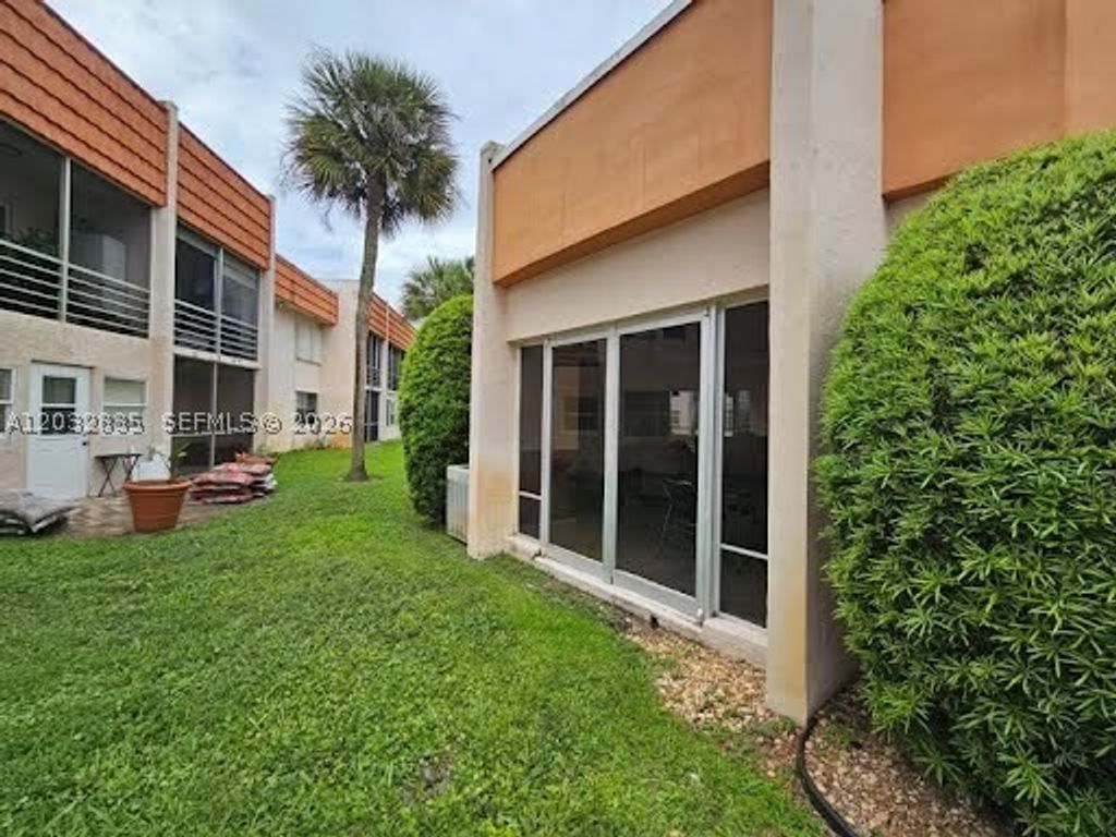 Photo of 7610 Stirling Rd #104C, Davie, FL 33024 (MLS # A12032835)
