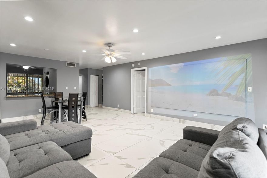 Step into comfort and entertainment with this charming condo featuring built-in projectors in both the living room and master bedroom for the ultimate home theater experience, perfect for the whole family. The updated kitchen adds a modern touch and very spacious bedroom and closet space. Located in a quiet, safe community surrounded by lush nature, residents enjoy fantastic amenities: sparkling pool, sports courts, gym, clubhouse with billiards, and a BBQ area under the trees. All this while being conveniently located across from a shopping plaza with Walmart, Ross, Marshalls, restaurant and just minutes to the Turnpike, 441 and the beach. A perfect balance of lifestyle, entertainment, and location! Right at the intersection of three Cities, Margate, Coconut Creek and Pompano Beach. 5% DP