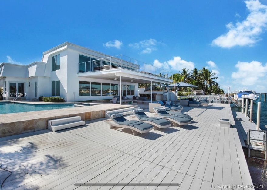 Welcome to 1055 Stillwater Drive. Miami Beach's best-kept secret, and visit this 7 bedrooms 5 bathrooms waterfront home sitting on a large 11764 Sq. Ft lot. a luxurious guard-gated Island in Miami Beach. You'll be in love with the panoramic open bay view. This beautiful home boasts 78 FT water frontage. Bring your boat, jet ski, kayaks and enjoy the waterfront Miami Beach lifestyle. This spacious two-story home features two master suites, a private one on the second floor with an extra-large porch to enjoy breathtaking views of Indian Creek, Biscayne Bay, and Surfside Skyline. Watch the dolphins and the manatees right at your feet. The outdoor porch offers spacious sitting and lounge areas some of them nicely covered to enjoy this lifestyle during summer and winter days.