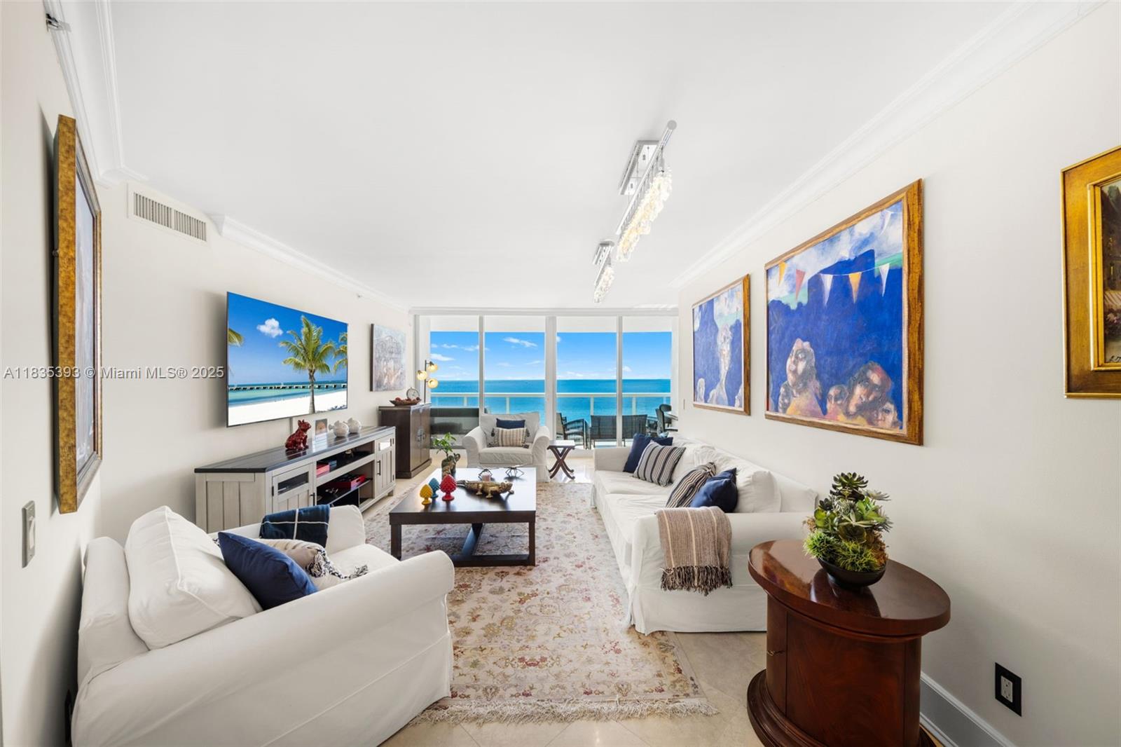 Welcome to unit 2202 and 2203, two premier oceanfront lines combined into one expansive residence offering the ultimate in comfort and space. This fully furnished 4 bedroom, 4.5 bath home offers 3,540 sq ft of interior living area with floor-to-ceiling glass and direct ocean views. Thoughtfully designed with two separate living rooms, three balconies, a spacious dining area, and a with a sleek modern kitchen overlooking the ocean. The split floor plan includes two generously sized primary suites, each with dual vanities, a soaking tub, and a separate shower. The building also offers resort like amenities featuring a large pool, tennis courts, cafe, a spa, fitness classes, beach service, beauty salon and more. Unit is available ideally starting in November, but owner is flexible with terms.
