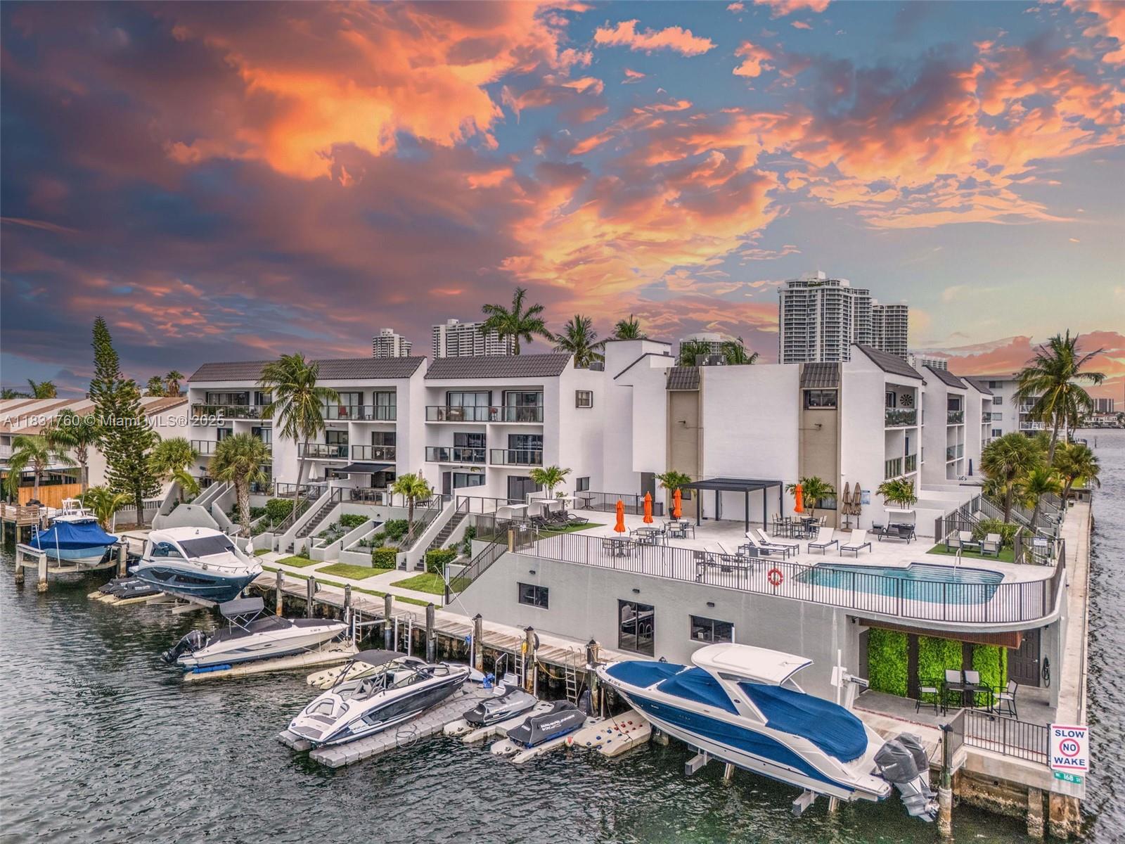 Spectacular waterfront residence, exquisitely designer decorated including the finest top-of-the-line appliances. Spacious master suite on the second floor opens to a terrace with stunning water views. The main level features an open kitchen, a great family/dining room and a spacious terrace perfect for relaxing or entertaining. Located on a quiet cul-de-sac with 180-degree water views, this building was just greatly updated after its 40-year recertification. Enjoy resort-style amenities including a gorgeous pool area with new designer furniture, pergola, sauna, upgraded restrooms, modern exercise room, and an amenity lounge!