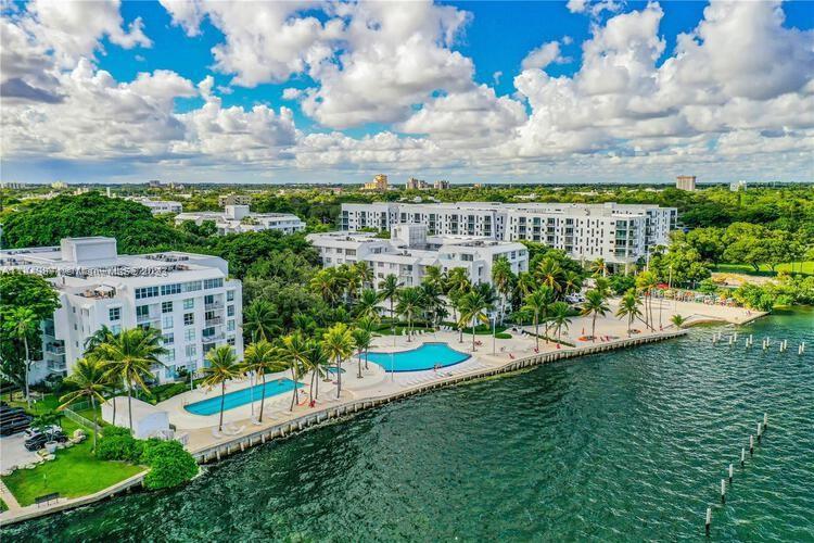 Welcome to Nirvana! Located in Miami’s trendy Upper Eastside neighborhood on Biscayne Bay. This beautiful 2/2 apt feels like a private home. Open floor plan, recessed lighting, spacious upgraded kitchen, marble counters, SS appliances. Master bedrm with walk-in closet. Tulum inspired 1,000SF terrace has hammocks, swings & movie projector perfect for entertaining. Private entrance & reserved parking. Lush vegetation, beach area to launch your SUP/Kayak, volleyball court, infinity/lap pools, jacuzzi, gym, 24-hour guard-gate. Walk to gorgeous Morningside & Legion parks & farmer’s market. Explore nearby tiny islands on your kayak. Nearby design district, Midtown, Wynwood. Short drive to Brickell, beaches, and Miami Int’l airport. So much to appreciate in this nature filled urban oasis!