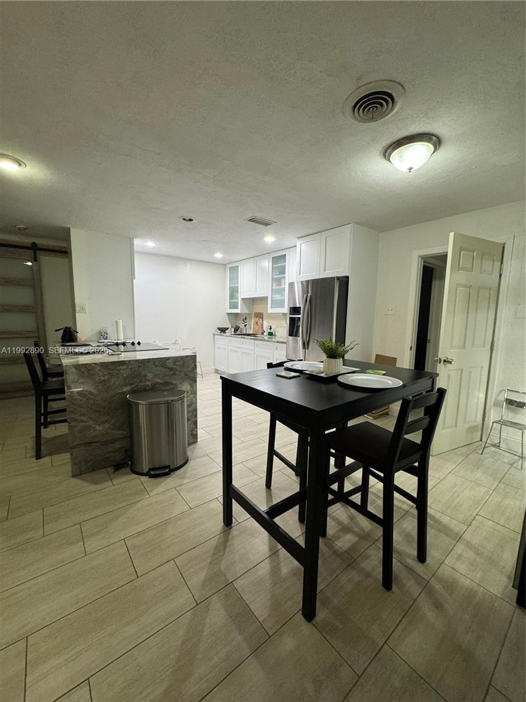 Photo of 5890 NW 16th Ct, Sunrise, FL 33313 (MLS # A11992890)