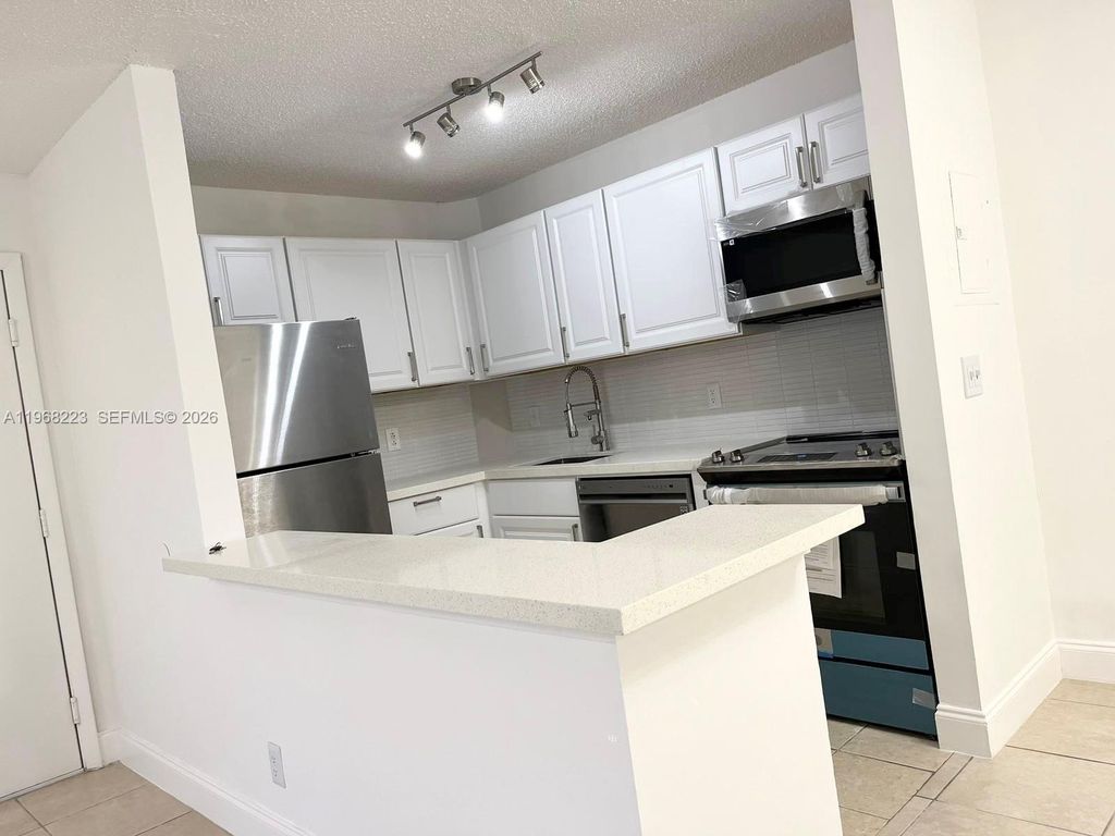 Photo of 10773 Cleary Blvd #204, Plantation, FL 33324 (MLS # A11968223)