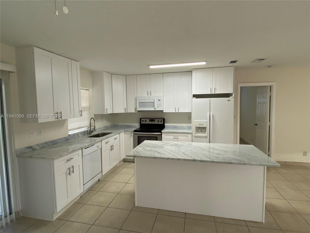 Photo of 851 SW 63rd Way #851, North Lauderdale, FL 33068 (MLS # A11941099)