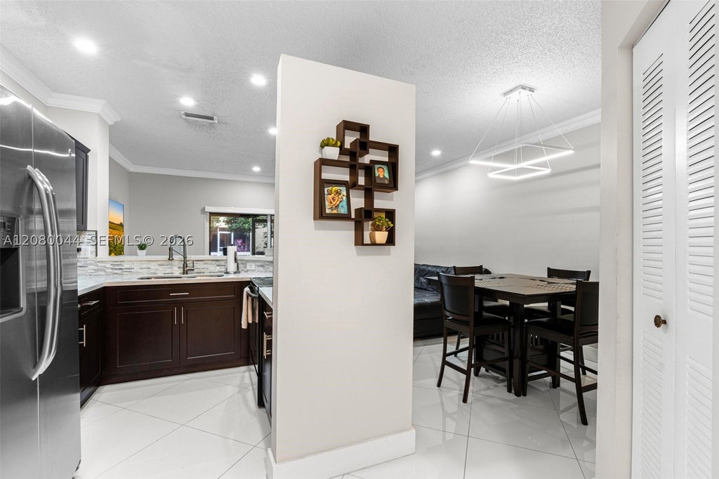 Photo of 12110 SW 2nd St, Pembroke Pines, FL 33025 (MLS # A12080044)