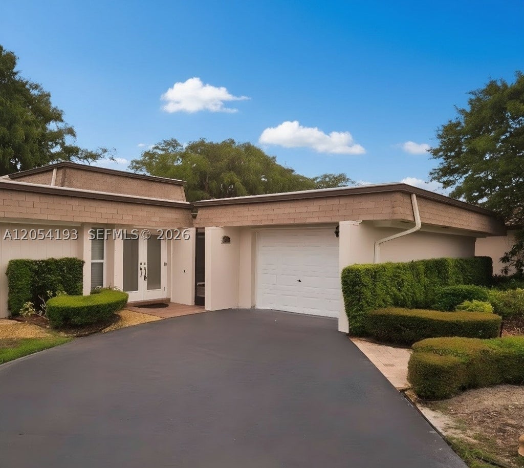 Photo of 4602 King Palm Dr, Tamarac, FL 33319 (MLS # A12054193)