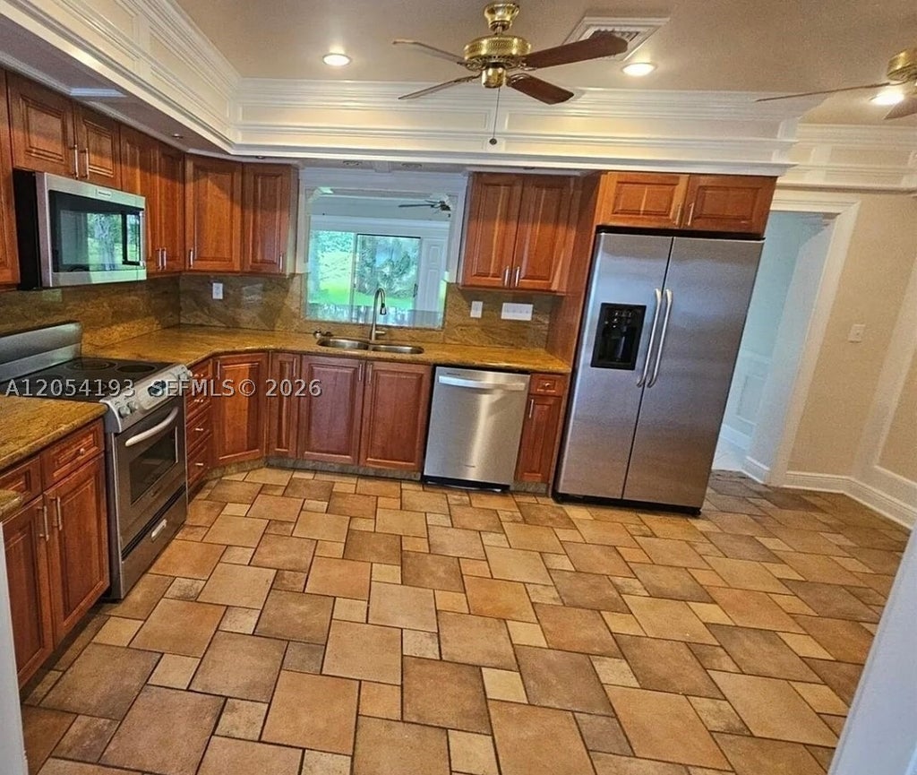 Photo of 4602 King Palm Dr, Tamarac, FL 33319 (MLS # A12054193)