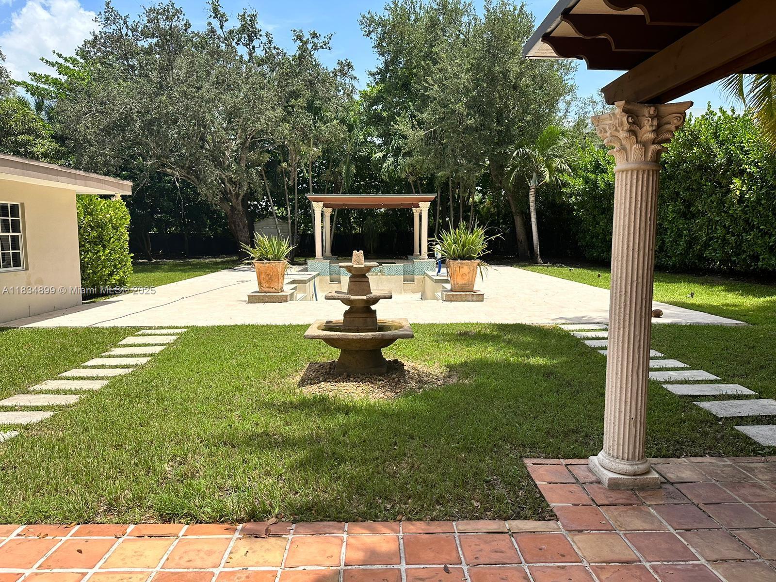 This beautiful 5 bedrooms 4 bathrooms home sits on over one acre lot in the highly desirable East Kendall area close to Baptist Hospital. This location has a lot to offer for the proximity of Dadeland and the Falls area. A lot of restaurants, groceries stores, shops, schools and main highways nearby. Property fenced and surrounded by several fruit trees. The large back yard offers lush tropical landscaping, pool, spa & summer kitchen ideal for entertainment. This house has four bedrooms, three baths, open concept, stainless steel appliances, Additional room for office space or extra bedroom plus In-law quarters with one bath, living area and private entrance. Two car garage, a lot of parking for Boat or RV.
