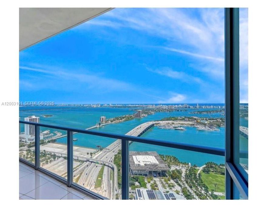 Stunning, Spacious & Bright unit with Panoramic City, Bay & Ocean Views. Finished to perfection with high ceilings, open kitchen, walk-in closets and an expansive private terrace, electric blinds & Private double elevator foyer entry. Master Suite w Direct Views of the Bay & Ocean. Bayfront Pool, Fitness Center & Spa with 24 hr Concierge & Security. Just a few steps to the Waterfront Park, Perez Art Museum, Frost Science Museum, Kaseya Center. FURNISHED! Unit is currently leased through May 14, 2026.