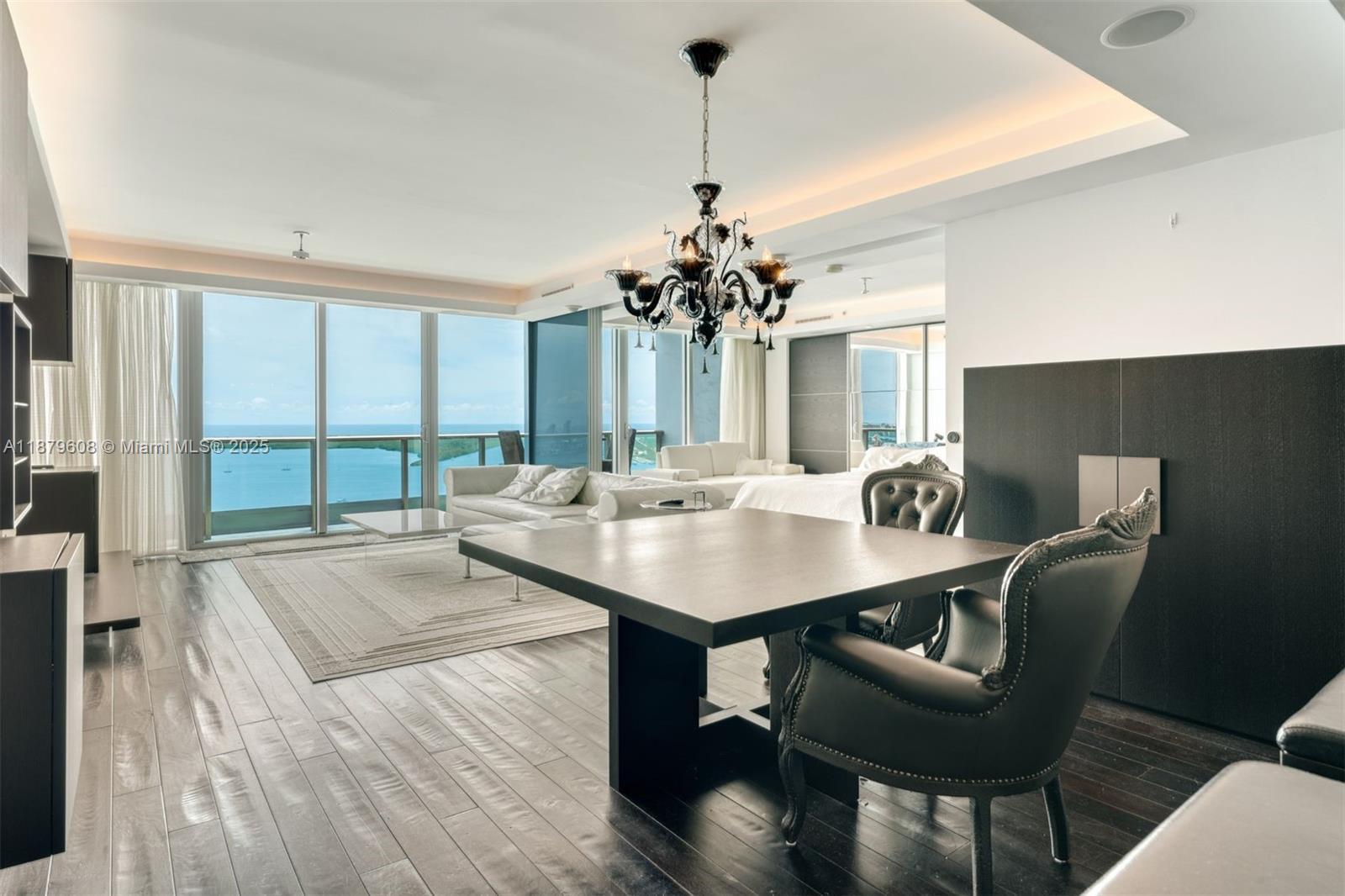 Spacious and elegant 2-bedroom plus den residence at the prestigious Jade. This fully furnished home offers floor-to-ceiling glass windows that flood the interiors with natural light and showcase stunning panoramic views of the ocean, bay, and city skyline. The flexible den is perfect as a home office, media room, or guest space. Designer furnishings, an open gourmet kitchen, and luxurious finishes throughout make this the ideal turnkey home. Residents of Jade enjoy world-class amenities including an infinity-edge pool, spa, state-of-the-art fitness center. Full service building, easy to show.