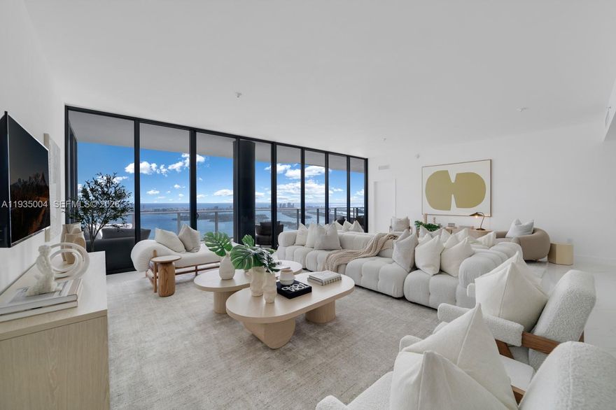 Rare 59th-floor penthouse at Aria Reserve South featuring a private 3-car garage and staff suite with full bath. This 2025, fully finished residence offers panoramic views of Biscayne Bay, the Atlantic Ocean, and Miami skyline through 11 ft floor-to-ceiling impact glass. Private elevator entry to your foyer with no shared hallways. Enjoy resort-level amenities surrounded by lush landscaping: pools, tennis, fitness center, spa, kids splash pad, dog park, theater, and more.