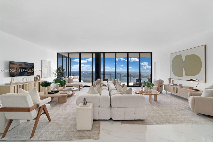 Rare 59th-floor penthouse at Aria Reserve South featuring a private 3-car garage and staff suite with full bath. This 2025, fully finished residence offers panoramic views of Biscayne Bay, the Atlantic Ocean, and Miami skyline through 11 ft floor-to-ceiling impact glass. Private elevator entry to your foyer with no shared hallways. Enjoy resort-level amenities surrounded by lush landscaping: pools, tennis, fitness center, spa, kids splash pad, dog park, theater, and more.