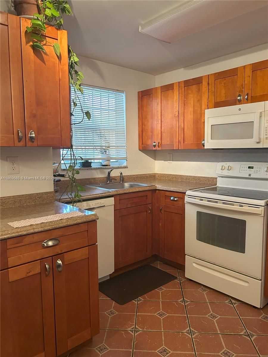 Welcome to this spacious and bright 2-bedroom, 2-bathroom residence located in the highly desirable Fontainebleau neighborhood. This well-established community offers a perfect blend of comfort, convenience, and lifestyle. The unit features tile flooring throughout and a private back porch that connects you with nature — a perfect spot to relax and unwind. Enjoy living in a full-service building, including a swimming pool, fully equipped gym, children’s playground, tennis courts, laundry facilities on-site, assigned parking, and an extra storage room. Centrally located just minutes from Miami International Airport, I-95, major hospitals, shopping centers, top-rated restaurants, only about 30 minutes from Miami Beach, the Design District, major universities, and key highways.