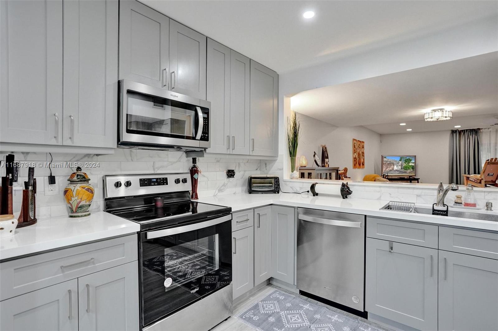 Remarkable + renovated townhouse condo nestled in the heart of the prestigious all-ages golf club community of Palm Aire. Featuring modern finishes, open-concept, a spacious living area filled with natural light, accentuated by elegant flooring and upgrades, this 2/2.5 is yours! Chef's kitchen boasts sleek cabinetry, stainless steel appliances, granite countertops & serene views. Choose the trail + waterway for easy book reading or escape upstairs for more privacy. A gorgeous primary bedroom, dual sinks, upgraded shower with walk-in closet and balcony to unplug into self-care. Additional highlights include ample storage, laundry closet upstairs covered by barn door. HOA includes roof, WIFI, cable, community center, 3 swimming pools, beautiful landscaping + golf community. 25% down.