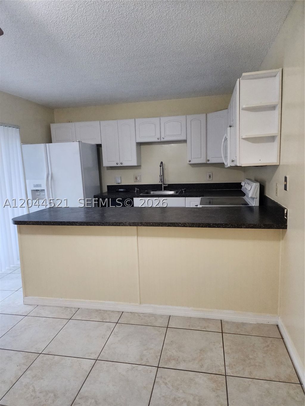 Photo of 2148 White Pine Cir #A, Green Acres, FL 33415 (MLS # A12044521)