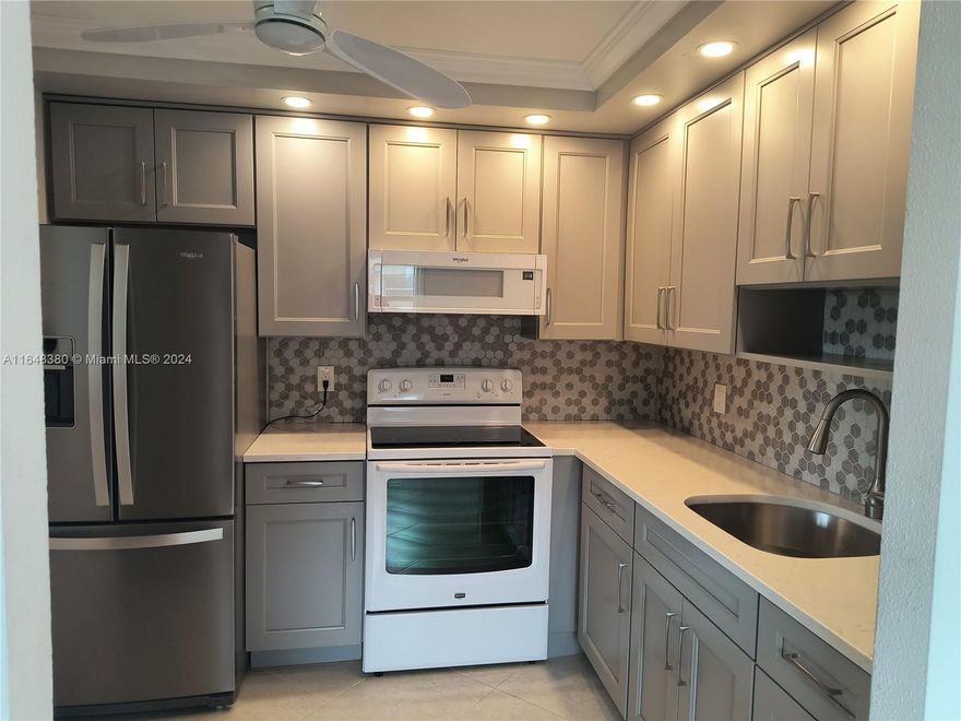 Bright and airy updated throughout 1-bedroom corner unit. Custom built kitchen with soft closing drawers and new appliances. Large diagonal tile floors in the living room. AC and water heater were replaced 4 years ago.  Plenty of storage. Washer /Dryer in unit. Building is located within a minute walk to the pool and cafe. 55+ Kings Point resort style community offers two club houses, indoor and outdoor pools, theater, state of the art gym, free shuttle within community and outside to the city, golf, tennis and much more. Minutes to shopping, restaurants, medical facilities, trendy Delray Beach downtown and only 15 min to the beach. Come enjoy amazing community without hefty club membership fees!