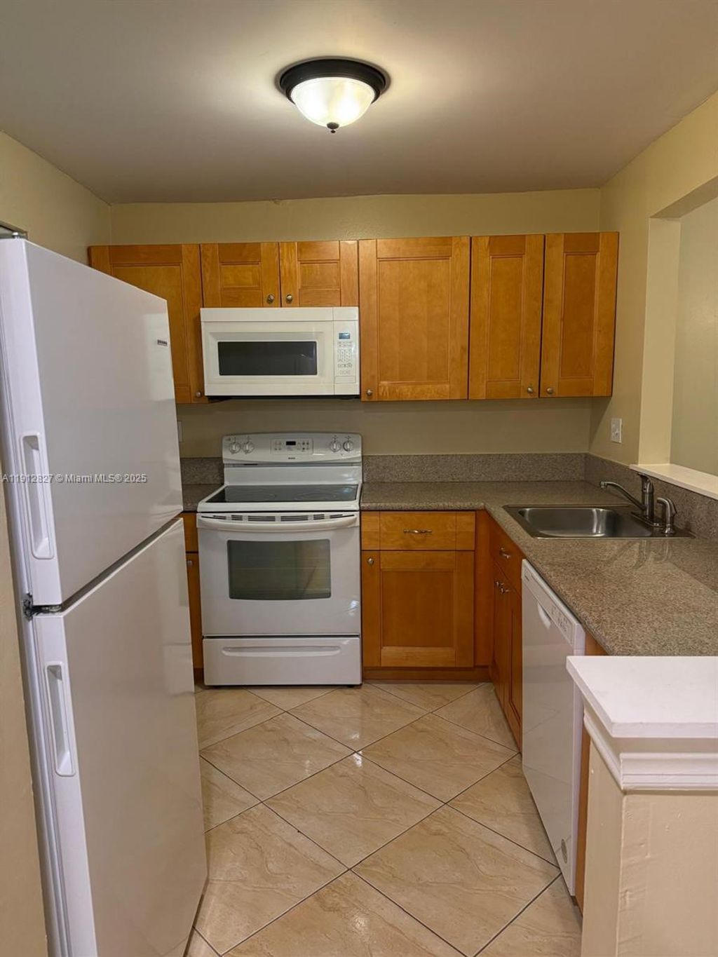 Photo of 3321 NW 47th Ter #428, Lauderdale Lakes, FL 33319 (MLS # A11912827)