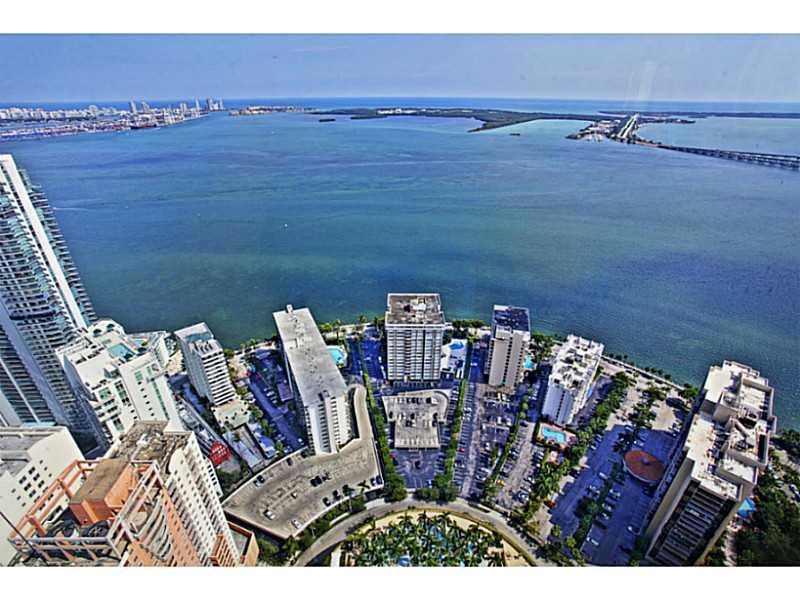 Stunning and breathtaking views of the ocean,bay&city of Miami from this exquisite South East corner residence in the Sky.With dramatic floor to ceiling windows in Miami's most prestigious address"Four Seasons Residences" you will find an ideal floor plan offering 3 bed/4.5Bath's+staff quarters and 10Ft ceilings.Hard wood floors throughout,custom built cabinets create the perfect ambiance for elegance & luxury.Enjoy a very private lifestyle at your fingertips with all the amenities of a five star hotel.