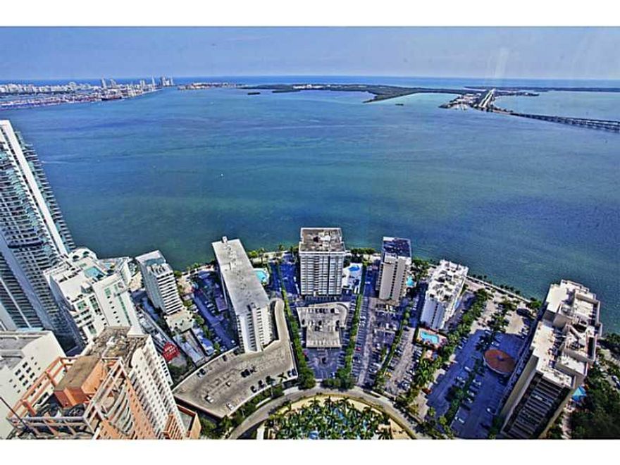Stunning and breathtaking views of the ocean,bay&city of Miami from this exquisite South East corner residence in the Sky.With dramatic floor to ceiling windows in Miami's most prestigious address"Four Seasons Residences" you will find an ideal floor plan  offering 3 bed/4.5Bath's+staff quarters and 10Ft ceilings.Hard wood floors throughout,custom built cabinets create the perfect ambiance for elegance & luxury.Enjoy a very private lifestyle at your fingertips with all the amenities of a five star hotel.