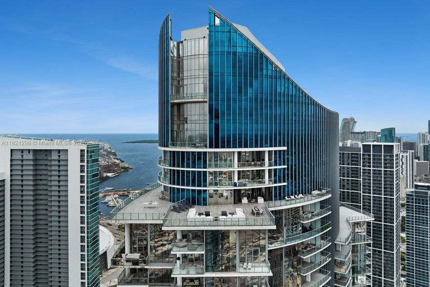 Soar above the city in this one-of-a-kind penthouse featuring the largest balcony in the iconic Paramount building. Set just above the newly completed $6B Miami Worldcenter project, this 4-bed + den, 5-bath residence offers a professionally designed interior and an oversized private balcony with panoramic city views. Inside, floor-to-ceiling windows and sliding glass doors flood the open layout with light. The spacious primary suite features direct balcony access, a walk-in closet, and a spa-like bath. Enjoy access to 46 world-class amenities (Paramount boasts the second most in the world) including multiple pools, spa, gym, basketball court & recording studio. All in a prime location just moments from shops, restaurants, the stadium, Brightline, Port of MIA, I-95, and South Beach.