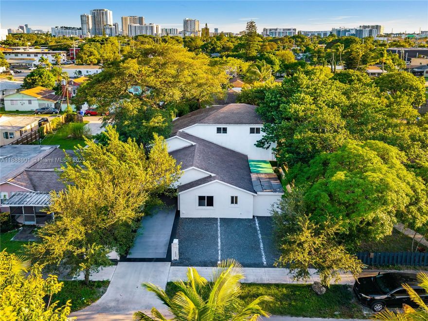 Licensed Airbnb retreat minutes from Downtown Hollywood. Built in 2010, the main home offers 5 bedrooms, 3.5 baths, vaulted double height ceilings, open floor plan, and a second floor primary wing with office and patio. A separate above, 2 car garage guest house includes a 2 bed, 1 bath apartment ideal for guests or rental income. Outdoor areas feature lush landscaping, lounging decks, and a spa beneath mature trees. Indoor/outdoor flow is seamless, creating versatile spaces for entertaining or relaxation. Prime location near beaches, shopping, and dining. Strong income potential and turnkey investment with existing Airbnb license.