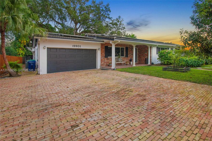 Two driveways accommodating security for up to 8 vehicles. No HOA fees. 2025 standing seam metal roof, complemented by 56 high-efficiency 400-watt solar panels providing on average 50.00 month in FPL energy bill. Robust 26 kW Generac standby natural gas generator, a total home water purification system, efficient total lawn irrigation system. Fully fenced modern metal fencing with smart power gate controls for seamless access. All doors and windows impact rated. In ground pool, surrounded by a protective pool cage enclosure. Travertine patio. Outdoor natural gas kitchen, full wet bar. Home is located just moments from top hospitals, physicians, diverse restaurants, excellent schools, the upscale Aventura Mall, Brightline train terminal, and both international airports, and nearby I-95 access at Ives Dairy Rd. Contact for showing appointment. Downsizing seller after 14 years.