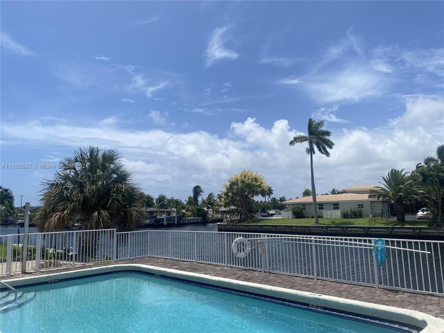 Prime Location! Amazing water views in one of the hottest redevelopment areas in South Florida! Enjoy Poolside sunny days on the waterfront while the Atlantic Blvd transforms into a Luxury Urban hotspot, with prices continuing to climb. Fully renovated 2/2 condo, Granite countertop ,Stainless appliances, marble bathrooms, wood laminated flooring throughout, Hurricane Impact windows, walk in closets, Bay window in back to enhance views, building just painted and new asphalt park lot with striping. Front loader washer and dryer in unit. 40-50 Certification completed