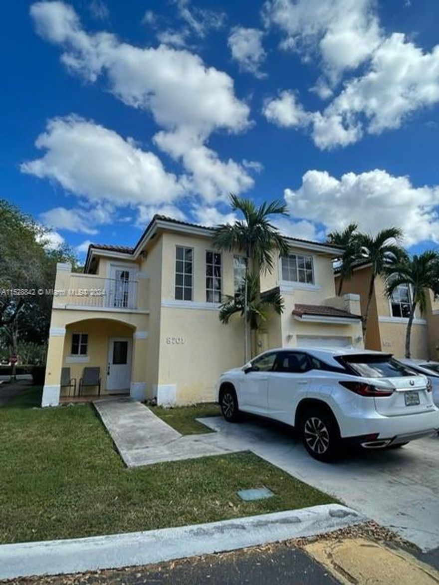 FOR RENT!  Beautiful and spacious 3 bedroom / 2-1/2 bathoom CORNER Townhome in gated and secured community.  1-car Garage plus 2 more cars in driveway and Guest parking.  Brand new remodeled Kitchen with stainless steel appliances.  Convenient 1/2 bathroom on 1st floor.  Patio and porch for entertaining.  Tile floors on 1st floor and laminate on stairs and 2nd floor.  Master suite with walking closet and private balcony.  Great Location...Behind Walmart at 157 Ave and 88th St.  And just across Home Depot. Close to schools, shopping centers, restaurants.